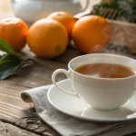 A steaming cup of Earl Grey tea with fresh bergamot oranges.