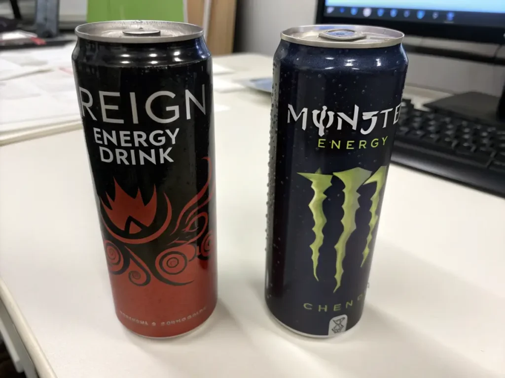 A side-by-side comparison of Reign Energy Drink and Monster Energy.
