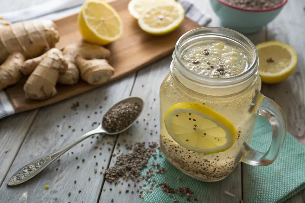 Halal ginger chia water in a glass with lemon and chia seeds
