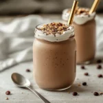 Red bean smoothies with toppings served in glass jars with bamboo straws
