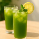 Matcha Lemonade in Tall Glasses with Lemon and Mint Garnish